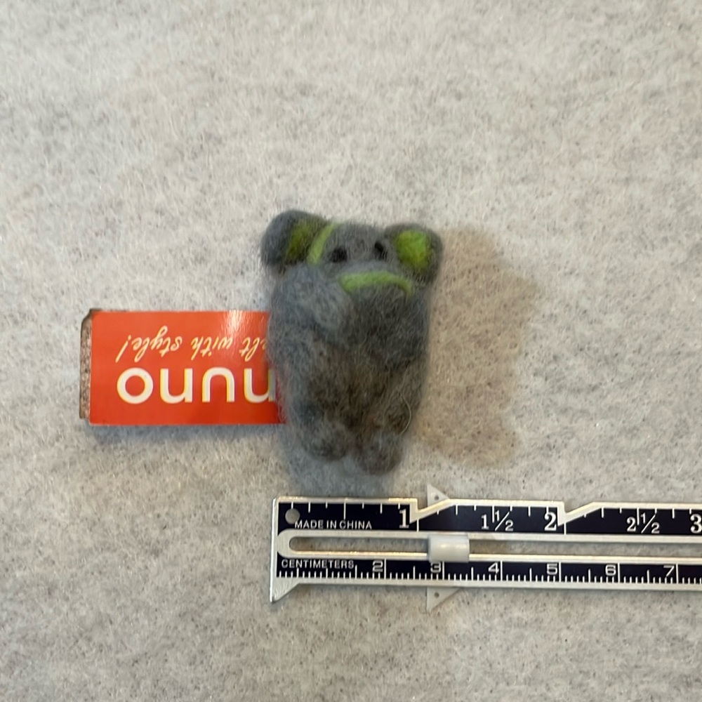 Handcrafted decorative pin. Felted Gray and green monkey.